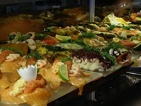 smørrebrød: an open-faced sandwich that usually consists of a piece of buttered rye bread, topped with...