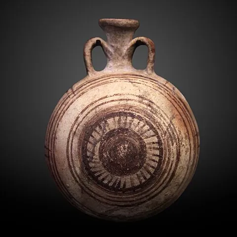 new year's bottle: a kind of lentoid bottle found in the cultures of Ancient Egypt, designed to be filled with Nile...
