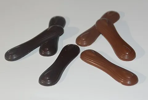 cat's tongue: a small chocolate bar or (sometimes chocolate-covered) cookie/biscuit which is shaped somewhat like...
