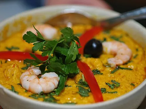 vatapá: an Afro-Brazilian dish made with bread, shrimp, coconut milk, peanuts and palm oil mashed into a...