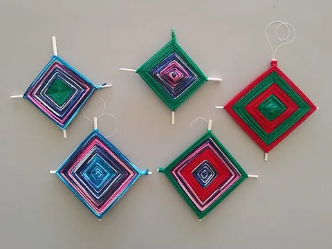 god's eye: a decorative diamond-shaped item woven from yarn, associated with Mexican and Central and South...
