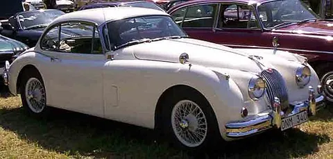fixed head coupé: a four-seated car or coupé with the appearance of a sports car, with a sloping rear and hardtop