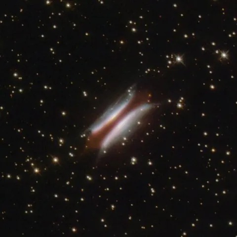 gomez's hamburger: a young A0III-type star with an apparent magnitude of +14.4 in the constellation Sagittarius at a...