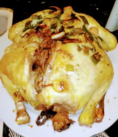 beggar's chicken: a Chinese dish of chicken that is stuffed, wrapped in clay and leaves, and baked slowly at a low...