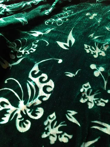 devoré: a fabric technique particularly used on velvets, where a mixed-fibre material undergoes a chemical...