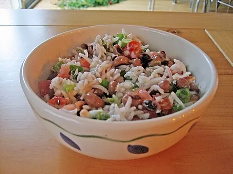 hoppin' john: a dish of rice and beans in the Southern United States, based on traditional West African dishes