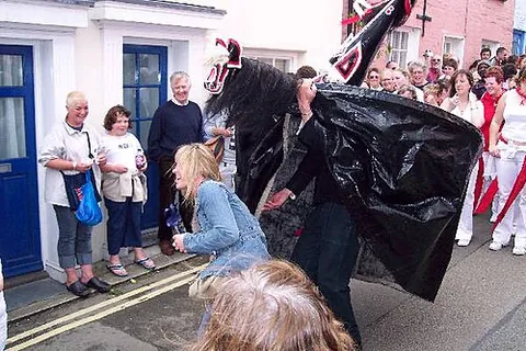 'obby 'oss: a male dancer dressed as a horse who cavorts through the town pretending to capture young maidens,...
