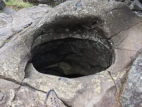 giant's kettle: a typically large and cylindrical pothole drilled in solid rock underlying a glacier either by...