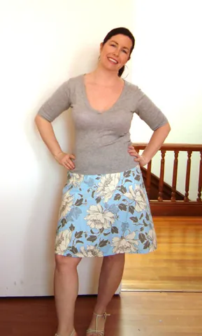 a-line: having a silhouette that replicates the letter A by flaring out from the top, like a funnel, narrow...