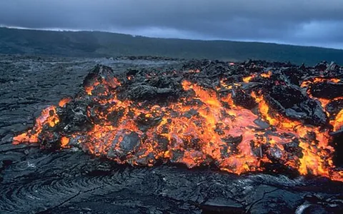 aa: a form of lava flow associated with Hawaiian-type volcanoes, consisting of basaltic rock, usually...
