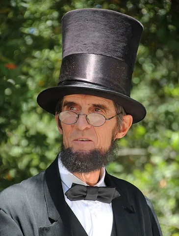 abraham lincoln hat: a black stovepipe hat of the kind worn by US president Abraham Lincoln