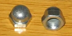 acorn nut: a closed nut having a dome-like cap over the rear protruding part of the engaged screw or bolt