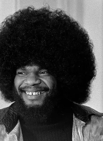 afro: a hairstyle characterized by tightly curled locks and a rounded shape