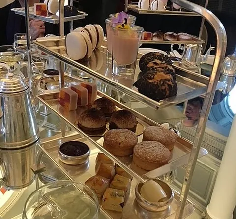 afternoon tea: a formal afternoon meal comprising light snacks, accompanied by tea