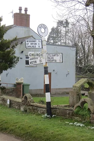 aikton: a village and civil parish in Cumberland council area, Cumbria, England, previously in Allerdale...