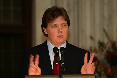 air quote: a typically two-handed gesture resembling quotation marks, indicating that the gesturer is speaking...
