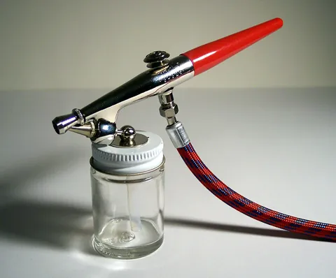 airbrush: a miniature, handheld paint sprayer, powered by compressed air or other gas, used for delicate,...