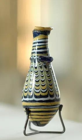 alabastron: a kind of ancient pottery vase used for holding oils, and originally made from alabaster