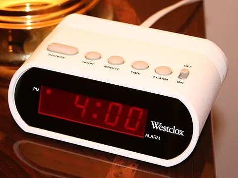 alarm clock: a clock designed to sound an alert at a preset time, primarily to wake someone from sleep