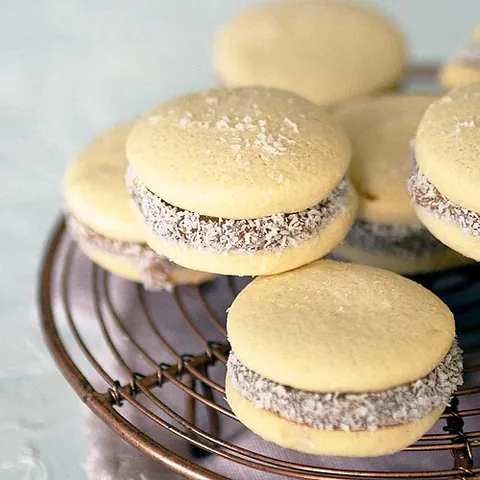 alfajor: a popular confection in South America usually made of flour, honey, and nuts and filled with a...