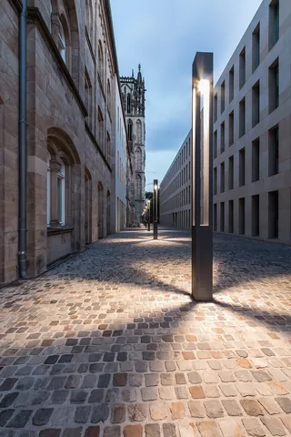 alleyway: a narrow street formed by the proximity of adjacent buildings
