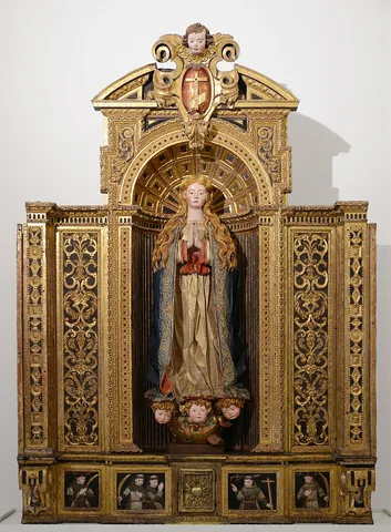 altarpiece: a work of art suspended above and behind an altar in a church
