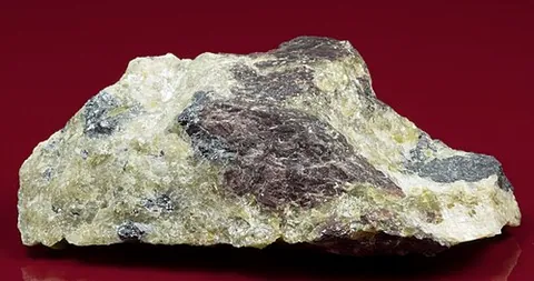 althausite: an orthorhombic-pyramidal gray mineral containing fluorine, hydrogen, magnesium, oxygen, and...