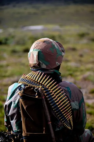 ammo belt: a strip used to hold bullets, sometimes connected to some firearms