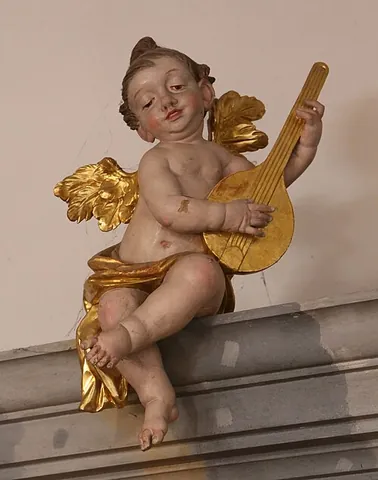 amoretto: a cupid or putto (representation of a naked baby or small child, often with wings)