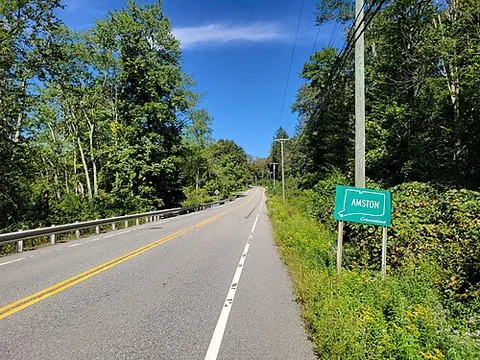 amston: a village in the town of Hebron, Tolland County, Connecticut, United States