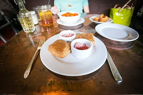 angel biscuit: a light, fluffy kind of biscuit (soft and flaky bread) made with multiple leaveners