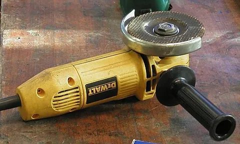angle grinder: a usually hand-held grinder which uses a pair of internal gears to place the rotational axis of the...