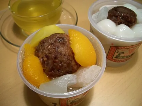 anmitsu: a Japanese dessert made of small cubes of agar jelly and served in a bowl with anko, boiled peas,...