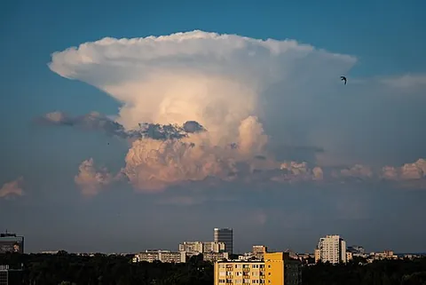 anvil cloud: a tall thundercloud (cumulonimbus) whose top has reached the tropopause and become flat, creating a...