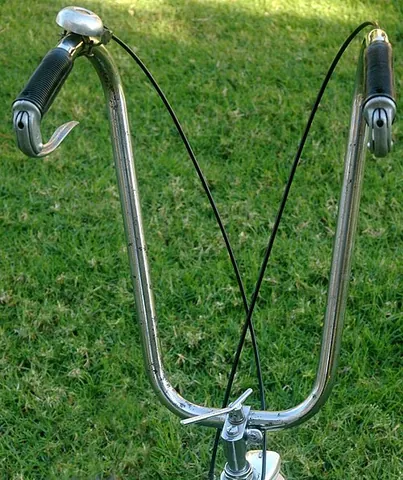 apehanger: a handlebar on a motorcycle positioned higher than the rider's shoulders