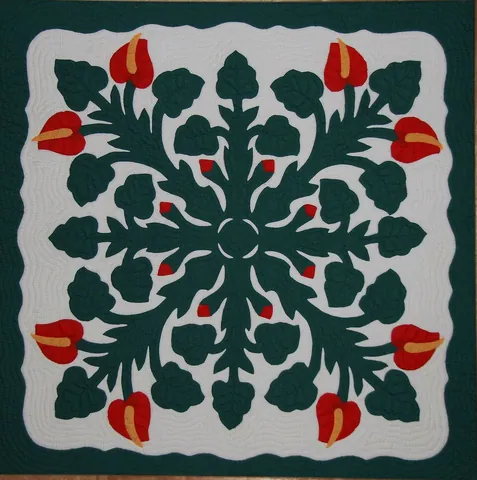 applique: a decorative design made by cutting pieces of material and applying them to the surface of another...