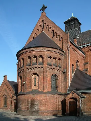 apse: the rounded east (liturgical east) end of a church that contains or is behind the altar