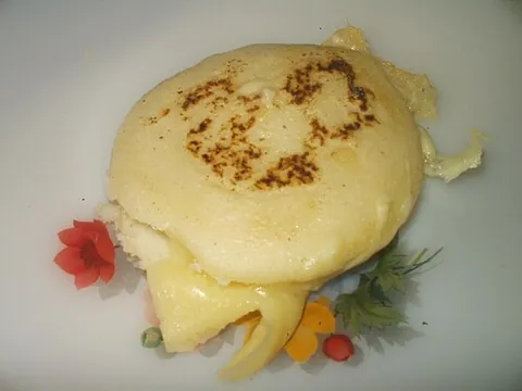 arepa: a type of cornbread originating from the northern Andes and resembling a tortilla