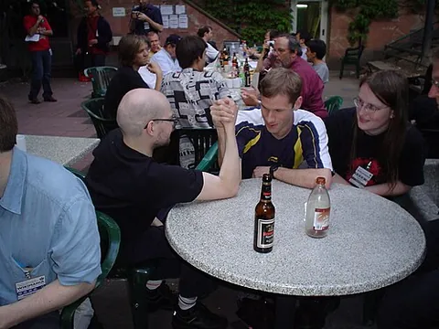arm wrestling: a strength sport with two participants, in which each participant grips the other's hand and tries...