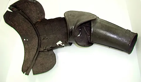armpiece: a piece of armour that protects the arm