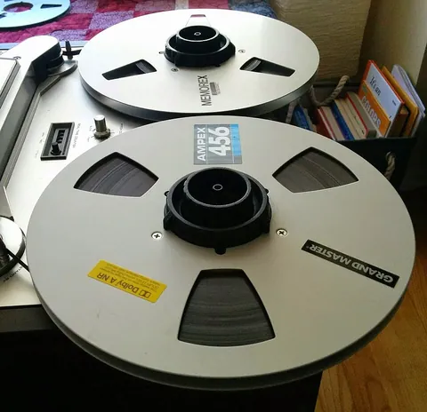 audiotape: a magnetic tape that stores analog sound for later playback on a tape player