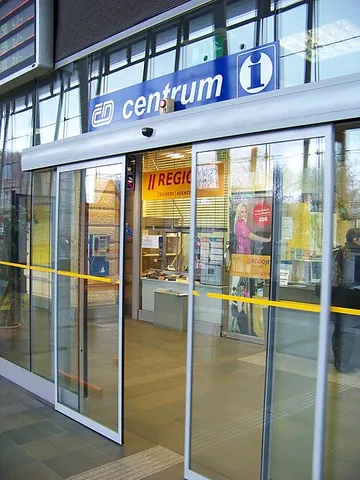 automatic door: a door that senses the approach of a person (by sensors or pressure pads etc.) and opens...