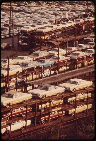 automobile car: a railroad car designed and used for the transportation of automobiles