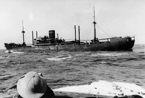 auxiliary cruiser: an armed merchantman, typically used as a commerce raider or as a convoy escort