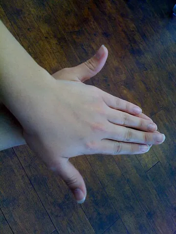 awkward turtle: an informal gesture used to indicate that a moment or situation is awkward