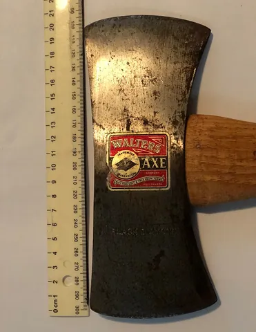axe: a tool for felling trees or chopping wood etc. consisting of a heavy head flattened to a blade on...