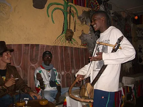 azmari: an entertainer who sings and plays traditional string instruments of the Ethiopian highlands