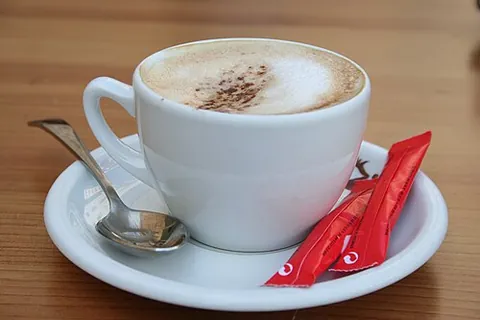 café con leche: a coffee beverage common throughout Spain and Latin America consisting of strong coffee (usually...