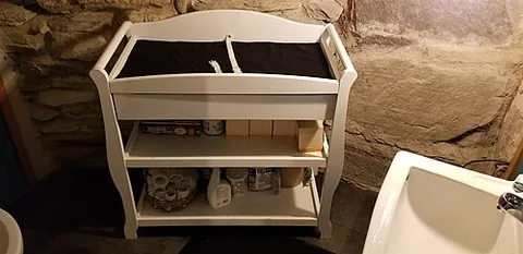 baby-changing station: a baby's changing table