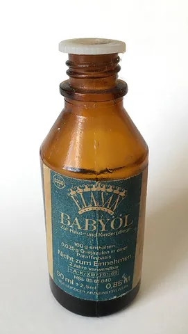 baby oil: a mineral oil used primarily to moisten the skin of babies after bathing